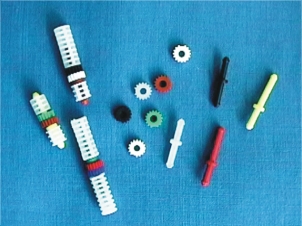 Colored Cogs and Spindles, with examples of Lantens attached